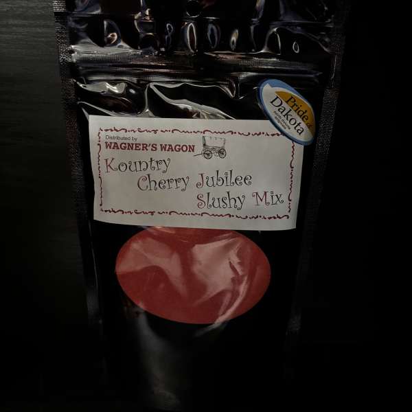 Black pouch of cherry jubilee slushy mix with a red fruit graphic
