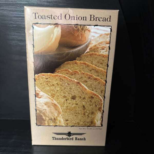 Box of toasted onion bread on a dark surface