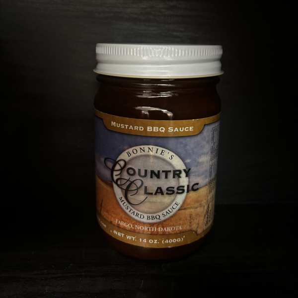 Jar of mustard BBQ sauce with a white lid