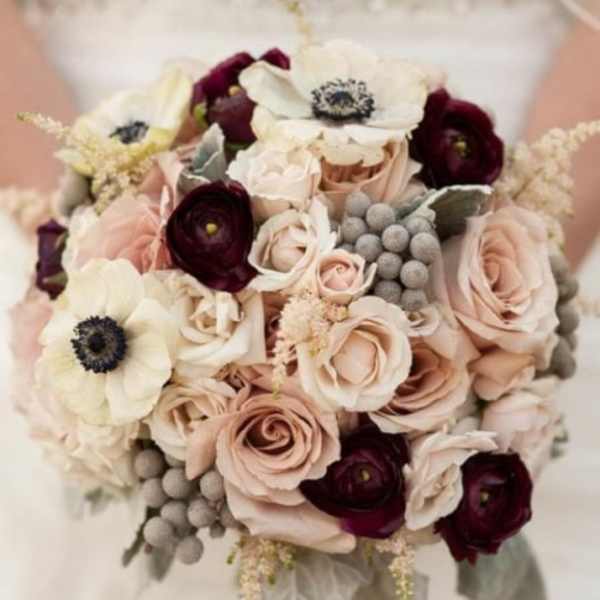 Bouquet of blush roses and dark burgundy flowers with white anemones