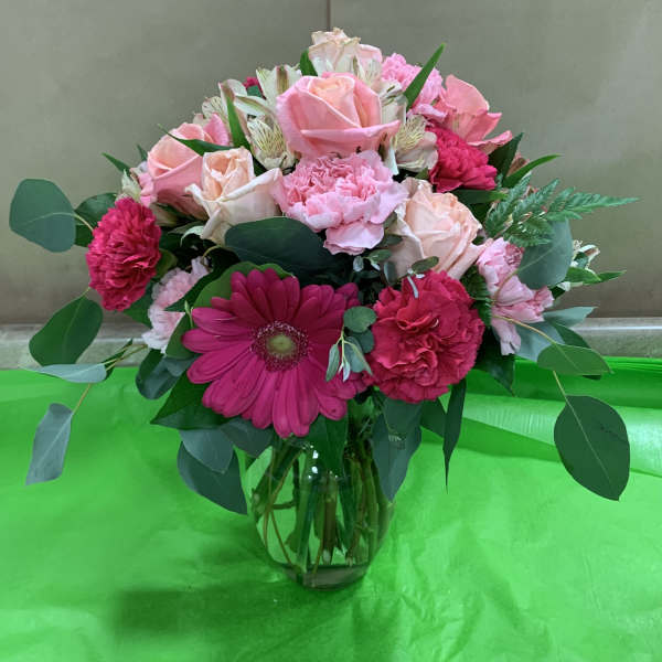 Pink mixed bouquet in a clear glass vase