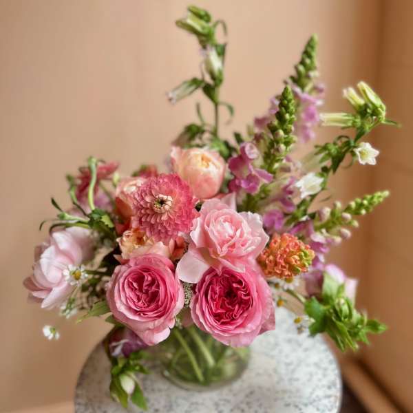 Pink mixed bouquet in a clear glass vase