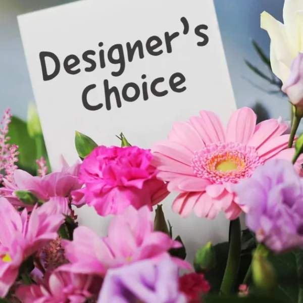 Pink and lavender flowers around a "Designer’s Choice" sign