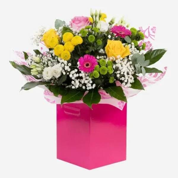Mixed bouquet in a bright pink gift box