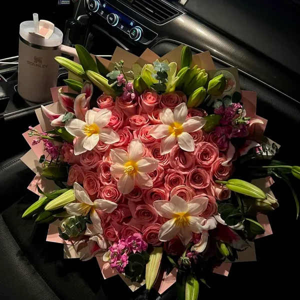 Pink rose bouquet with white lilies and pink filler flowers
