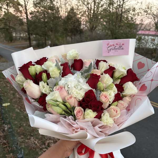 designer choose mix flowers Wraped bouquet!