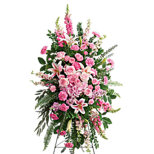 Tall pink floral standing spray on an easel