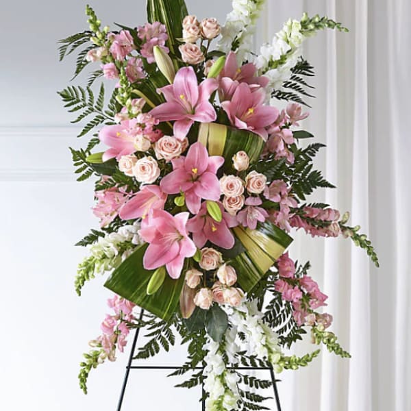 Tall pink and white floral standing spray on an easel