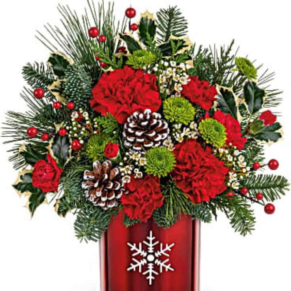 Christmas bouquet with red carnations in a red vase