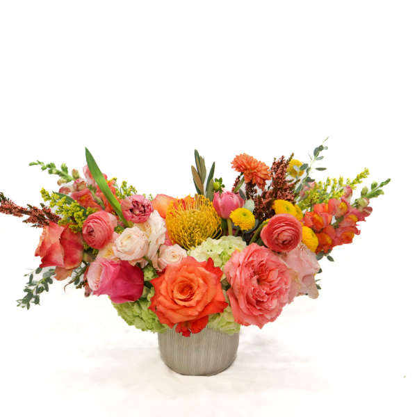 Colorful mixed bouquet in a gray vase