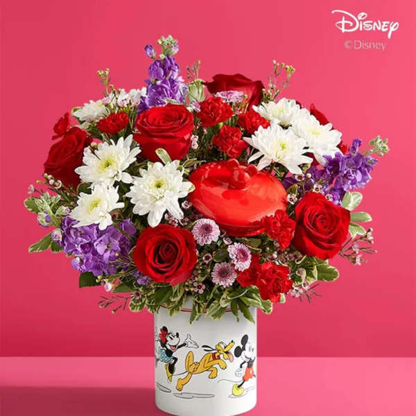 Red roses and white daisies in a Mickey Mouse vase with a heart box
