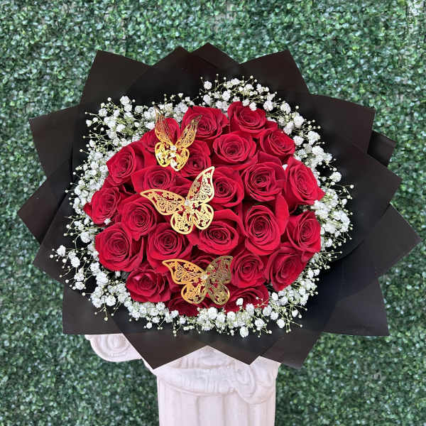 Bouquet of red roses with white baby's breath and gold butterfly accents