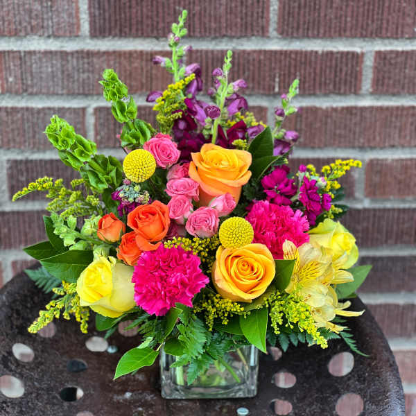 Colorful mixed bouquet in a clear glass vase