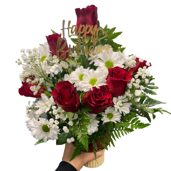 Bouquet of red roses and white daisies with a birthday topper