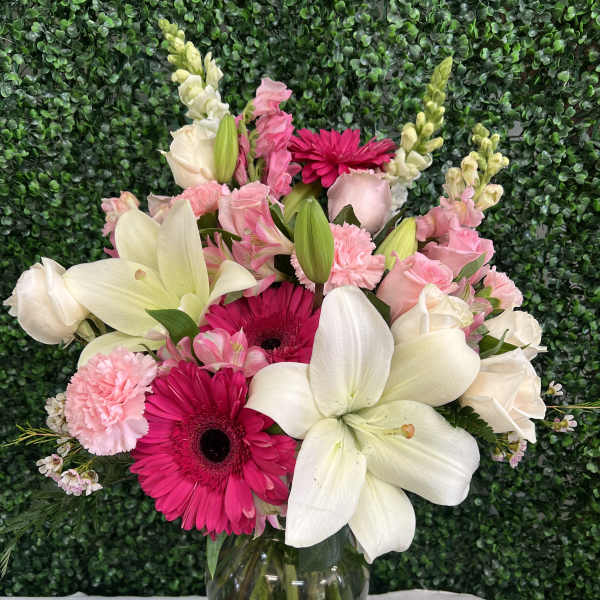 Pink and white mixed bouquet in a clear glass vase