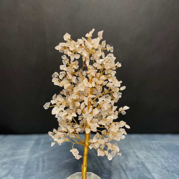 Wire gemstone tree with clear crystal chips on a faceted stone base