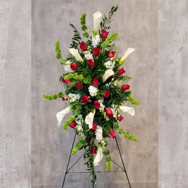 Tall standing floral spray with red roses and white calla lilies