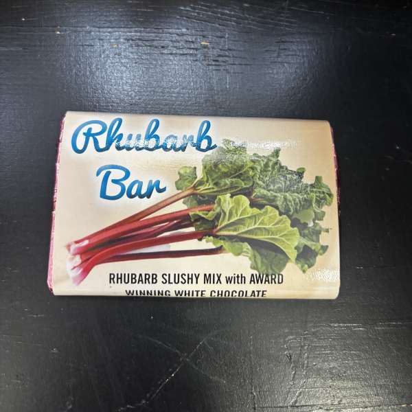 Box of Rhubarb Bar chocolate on a dark surface
