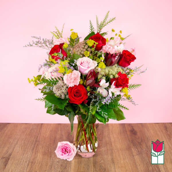 Bouquet of red and pink roses in a glass vase