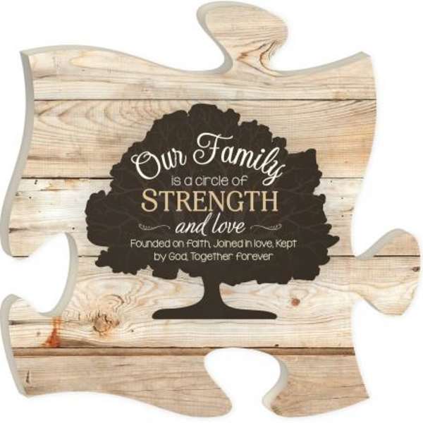 Wooden puzzle-piece sign with family quote and tree graphic