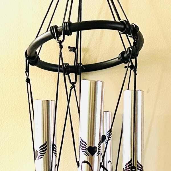 Black memorial wind chime with silver tubes and a heart pendant