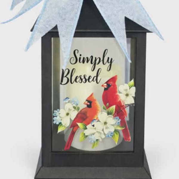 Black lantern with a blue bow and "Simply Blessed" card