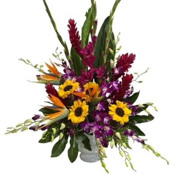 Tall tropical bouquet with sunflowers, purple orchids, and bird of paradise in a vase