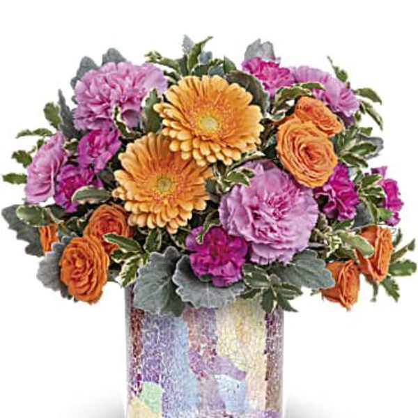 Mixed bouquet of orange, pink, and purple flowers in a mosaic vase