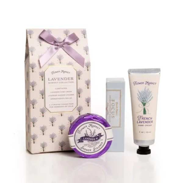 Lavender-themed gift set with hand cream, shower steamer, and boxed packaging