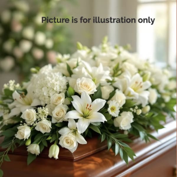 White floral casket spray with roses and lilies