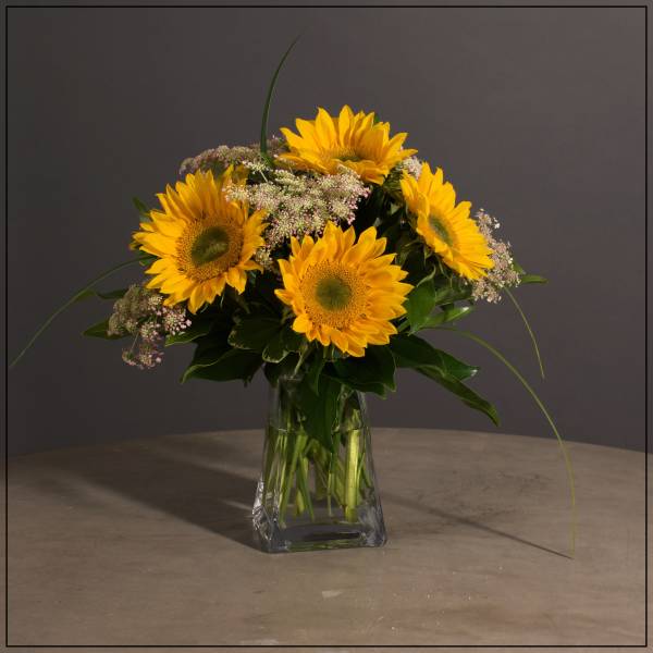 Sunflower bouquet in a clear glass vase