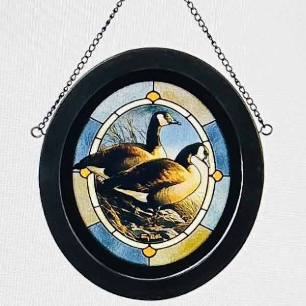 Round hanging plaque with a painted goose scene