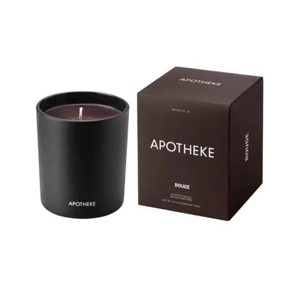 Black glass candle with matching dark box labeled Apotheke Rouge