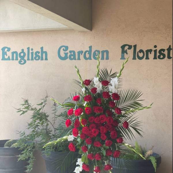 Standing floral spray of red roses and white gladiolus