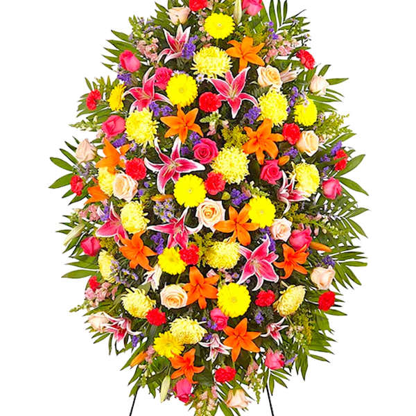 Large standing floral spray with bright mixed flowers on a white background