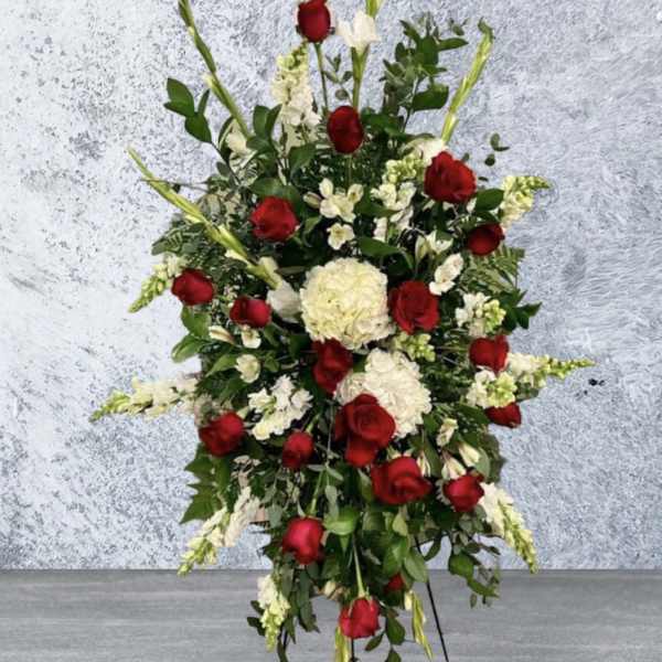 Tall standing floral spray with red roses and white flowers