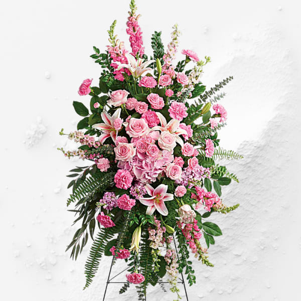 Tall pink floral standing spray on an easel