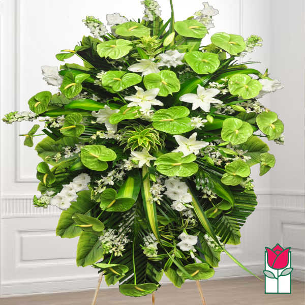 Large standing floral spray with white lilies and bright green anthuriums
