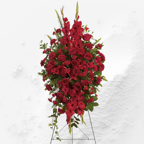 Tall red floral standing spray on an easel