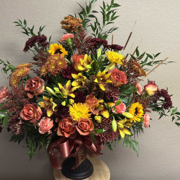 Large bouquet of roses, chrysanthemums, and lilies in a vase