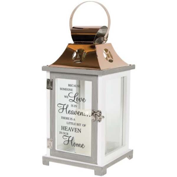 Decorative white lantern with a copper top and memorial text