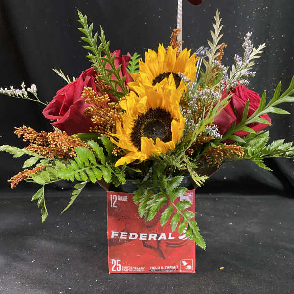 Bouquet of sunflowers and red roses in a red Federal box