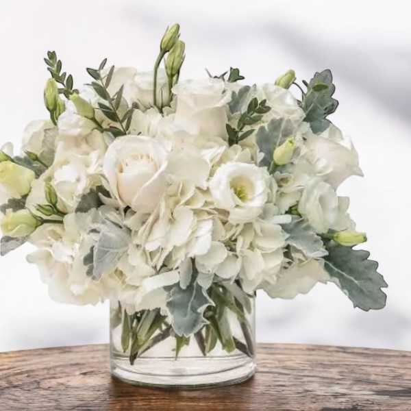 White floral bouquet in a clear glass vase