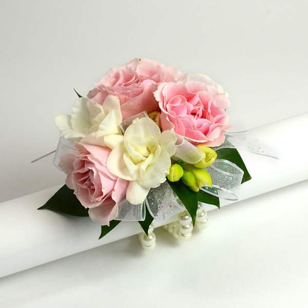 Pink and white rose bouquet with ribbon and pearl accents