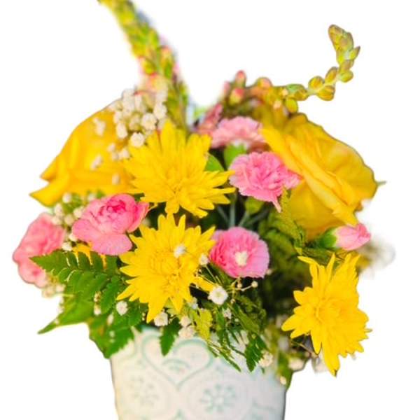Yellow and pink bouquet in a white ceramic pot