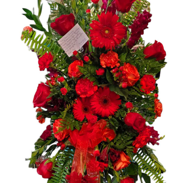 Tall red floral arrangement with roses and gerbera daisies