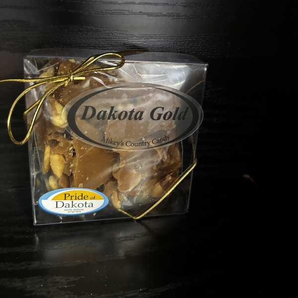 Boxed candy with a gold ribbon and label