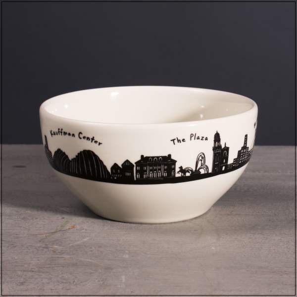 White ceramic bowl with a black city skyline and landmark names around the rim.