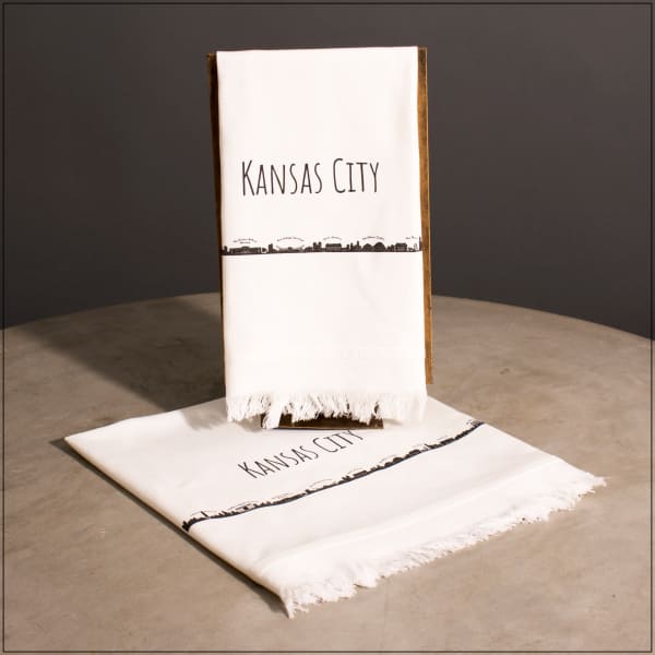 White Kansas City scarf with black text and skyline print