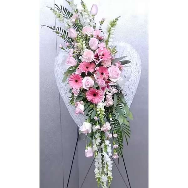 Pink and white standing floral spray on an easel